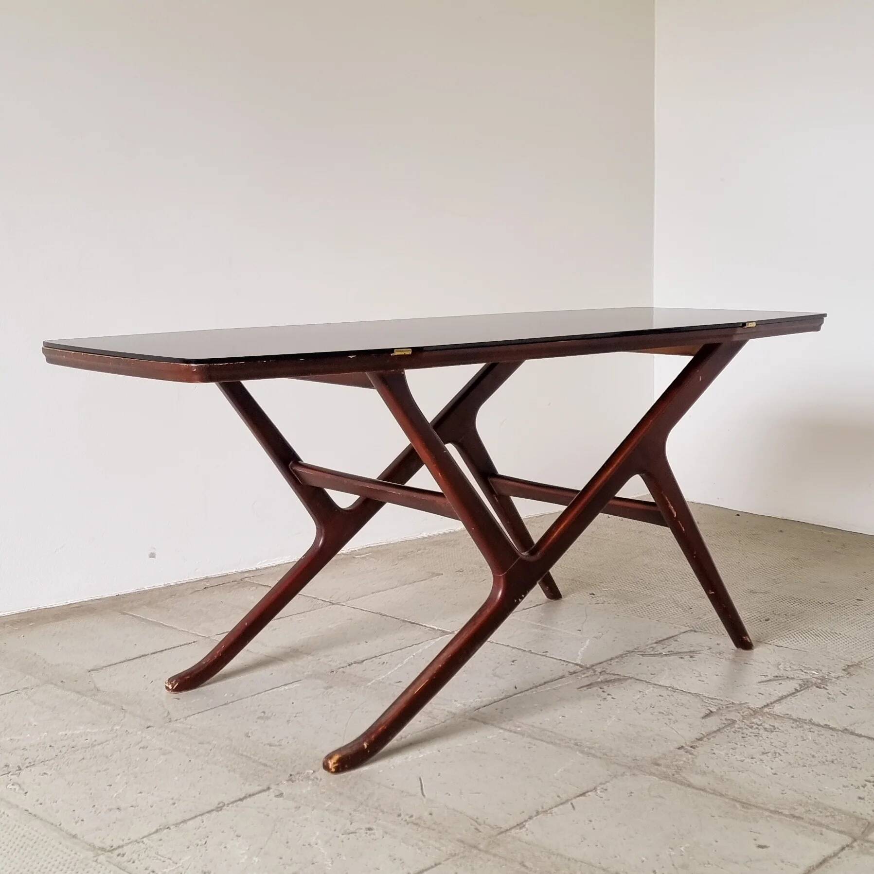 1950s Ilse Möbel coffee table with a black glass top.