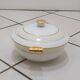 White and yellow porcelain dinner service with gold edging, Poral Limoges France