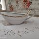 White porcelain saucière evor france frieze golden crosses