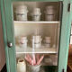 Small wooden cabinet patinated arsenic green