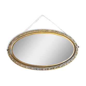 Old golden oval mirror