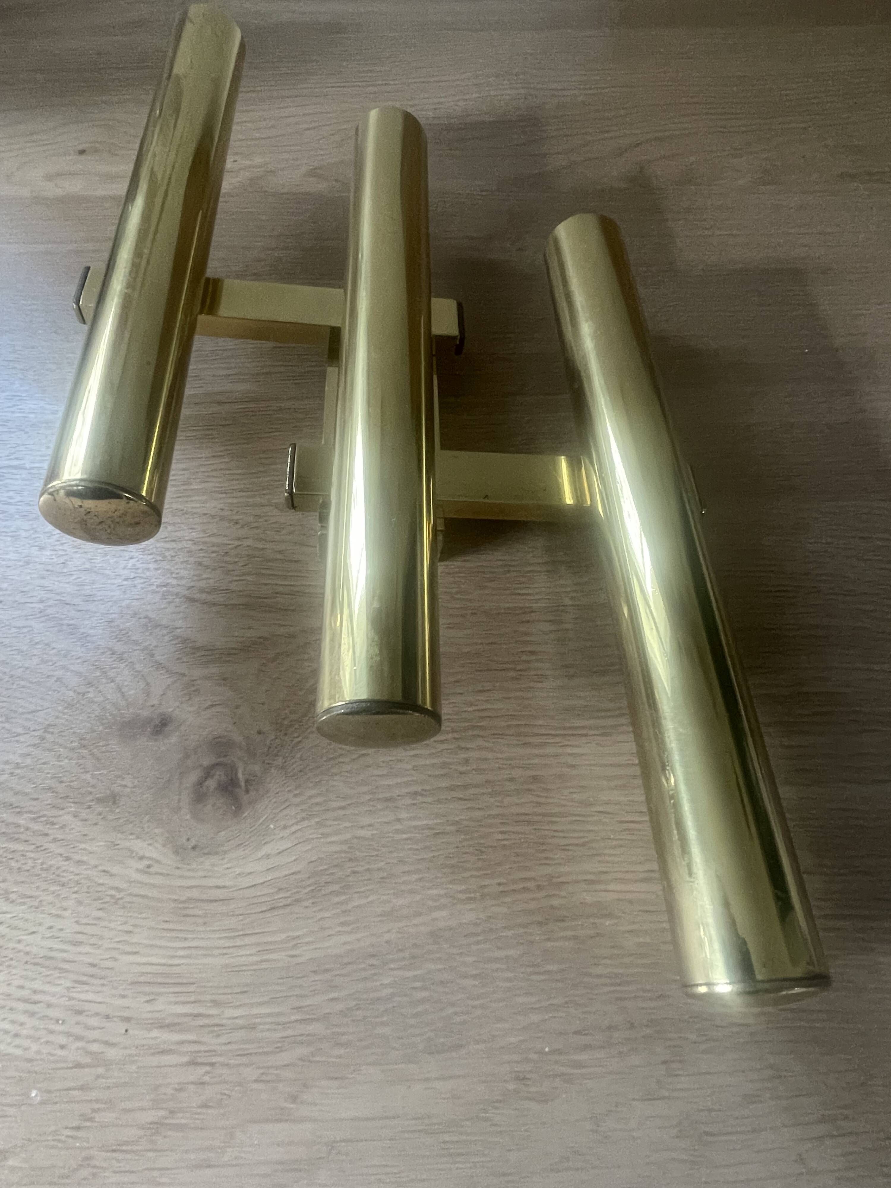 Tubular wall sconces in brass, Italian design from the 1970s, attributed.