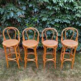 Set of four cane and webbing bar stools