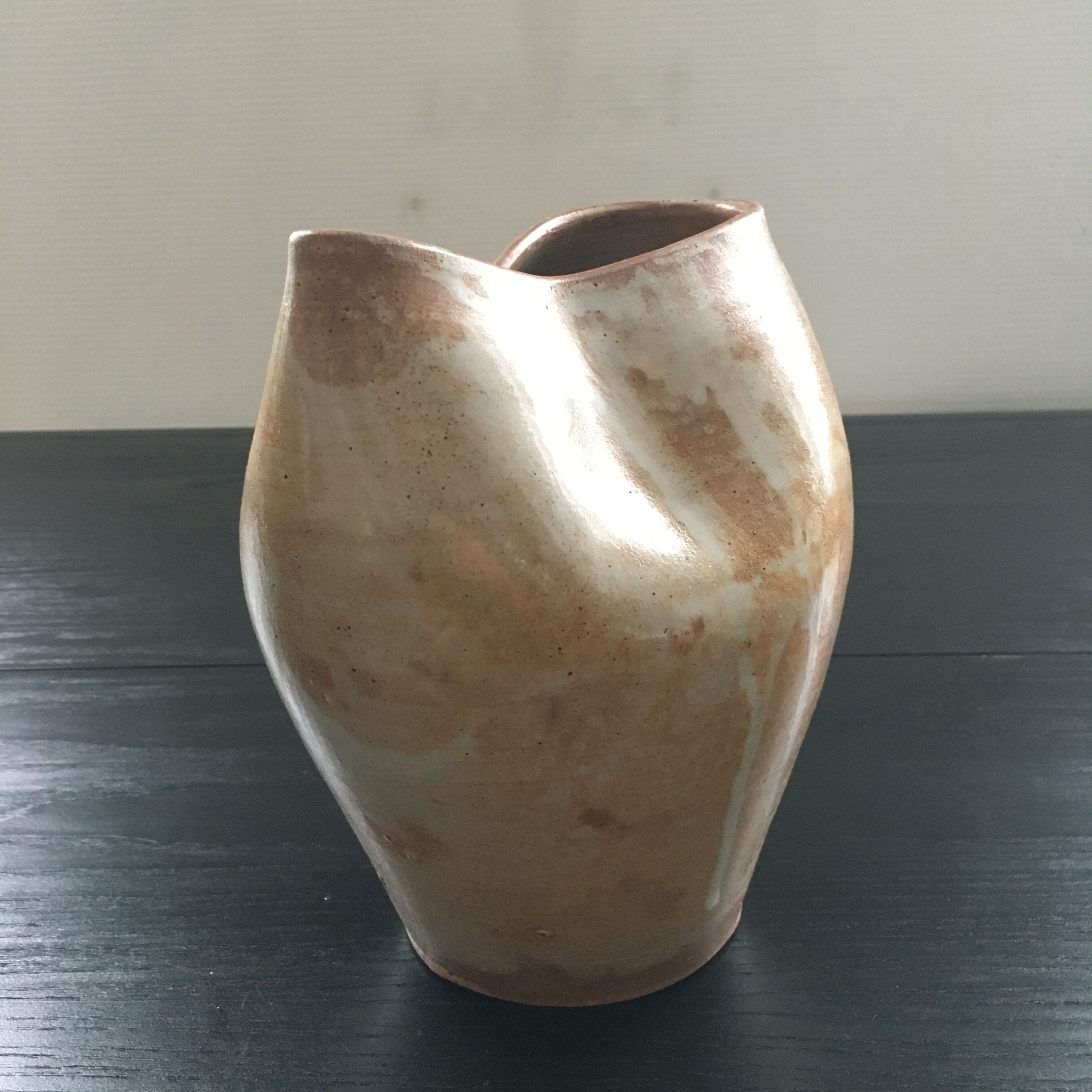 Beige stoneware pitcher with white drips