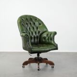 Large green cowhide Chesterfield office chair in English style on wheels