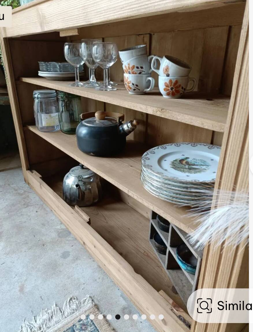 Open wooden chest of drawers