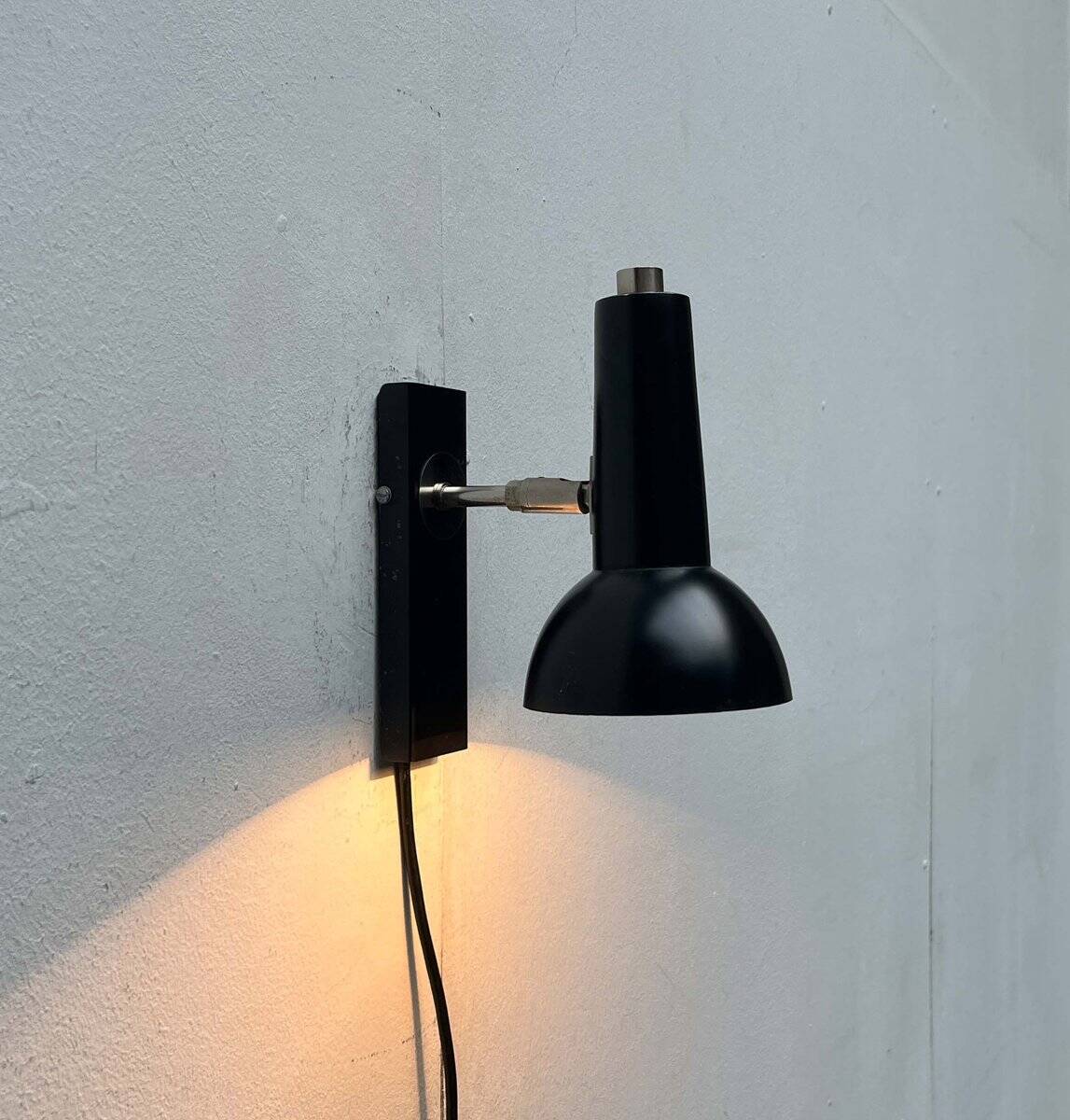 Mid-century German black minimalist wall lamp by Hustadt, 1960s.