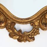 Baroque style oval wall mirror in gilded wood, France