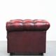 Red English cowhide Chesterfield armchair finished with decorative nails