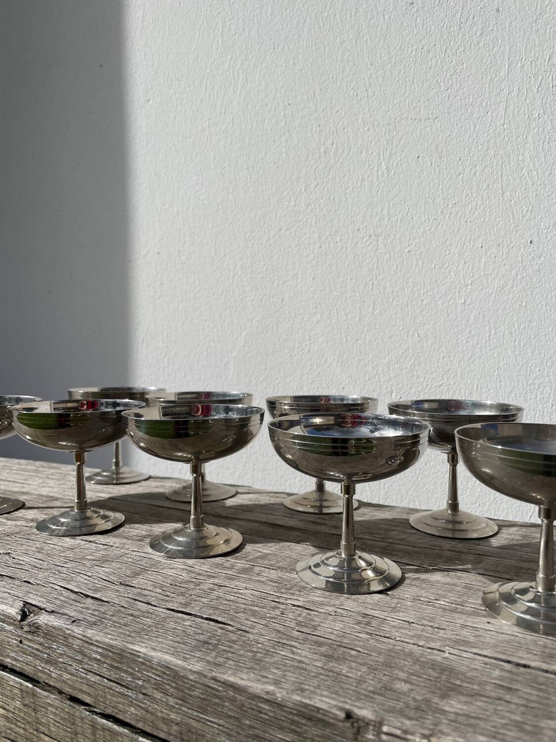 10 stainless steel cups signed Rémy Letang