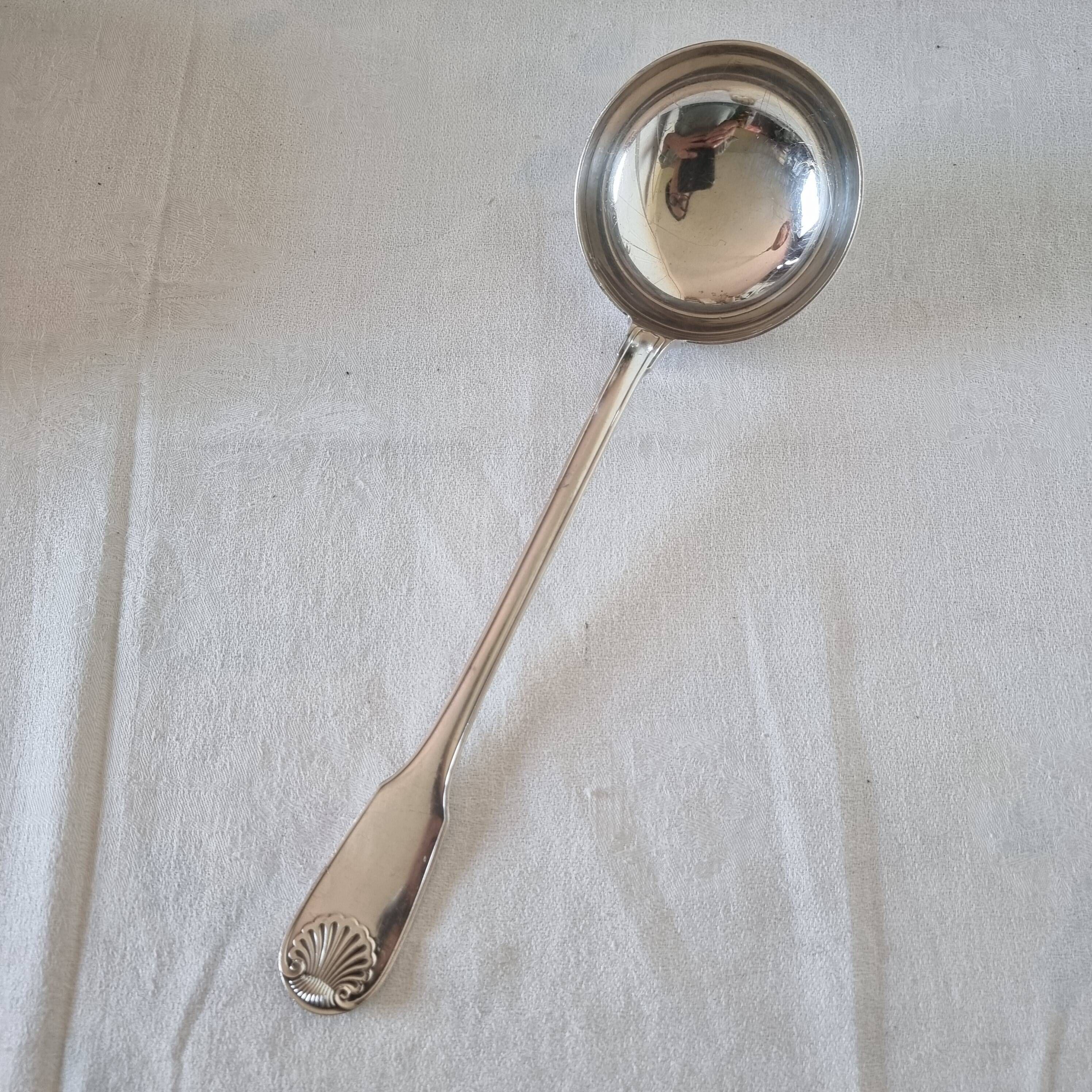 The Christofle silver-plated “Vendôme” cream ladle features a design