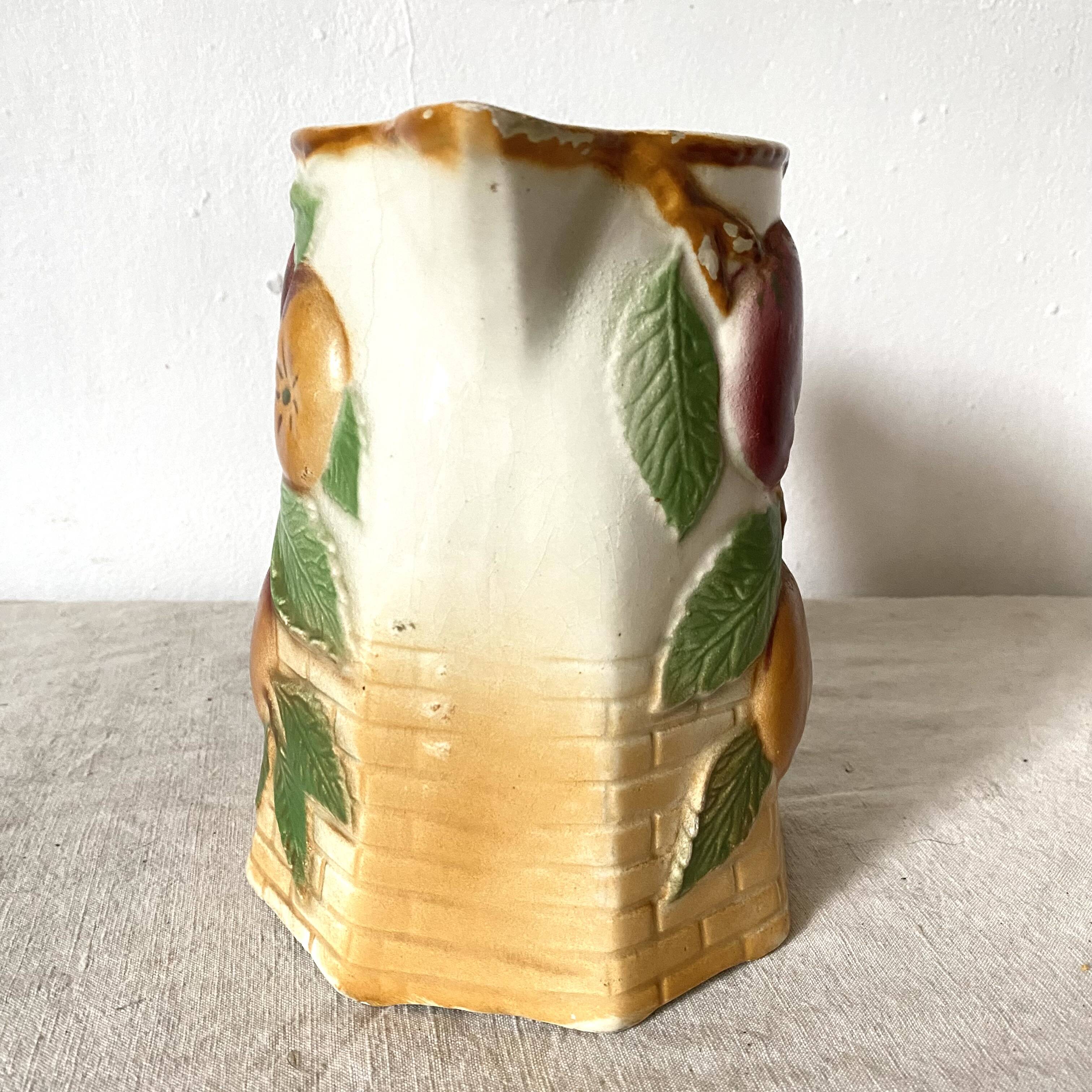 Antique pitcher in Apple slip