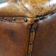 Antique armchair in patinated sheepskin