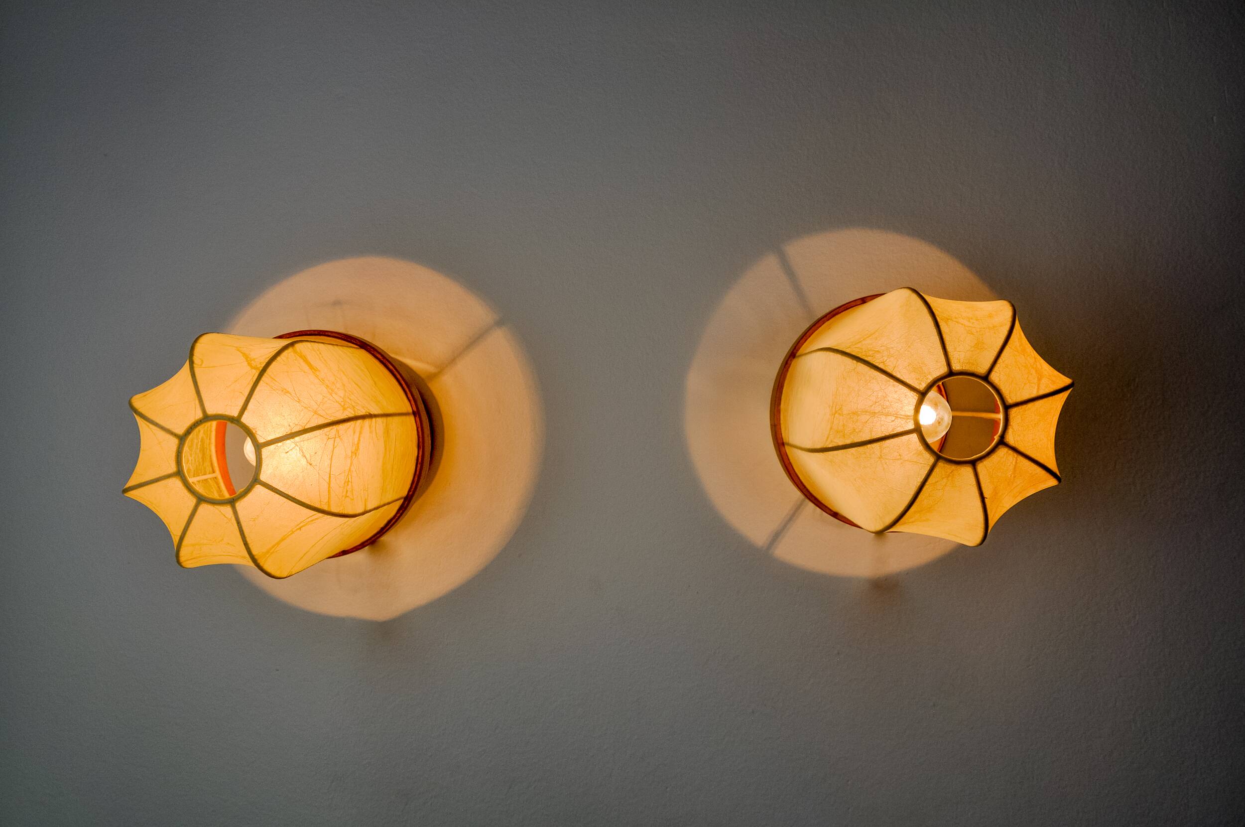 Pair of "cocoon" wall lights, polymer and pine, Italy, 1970