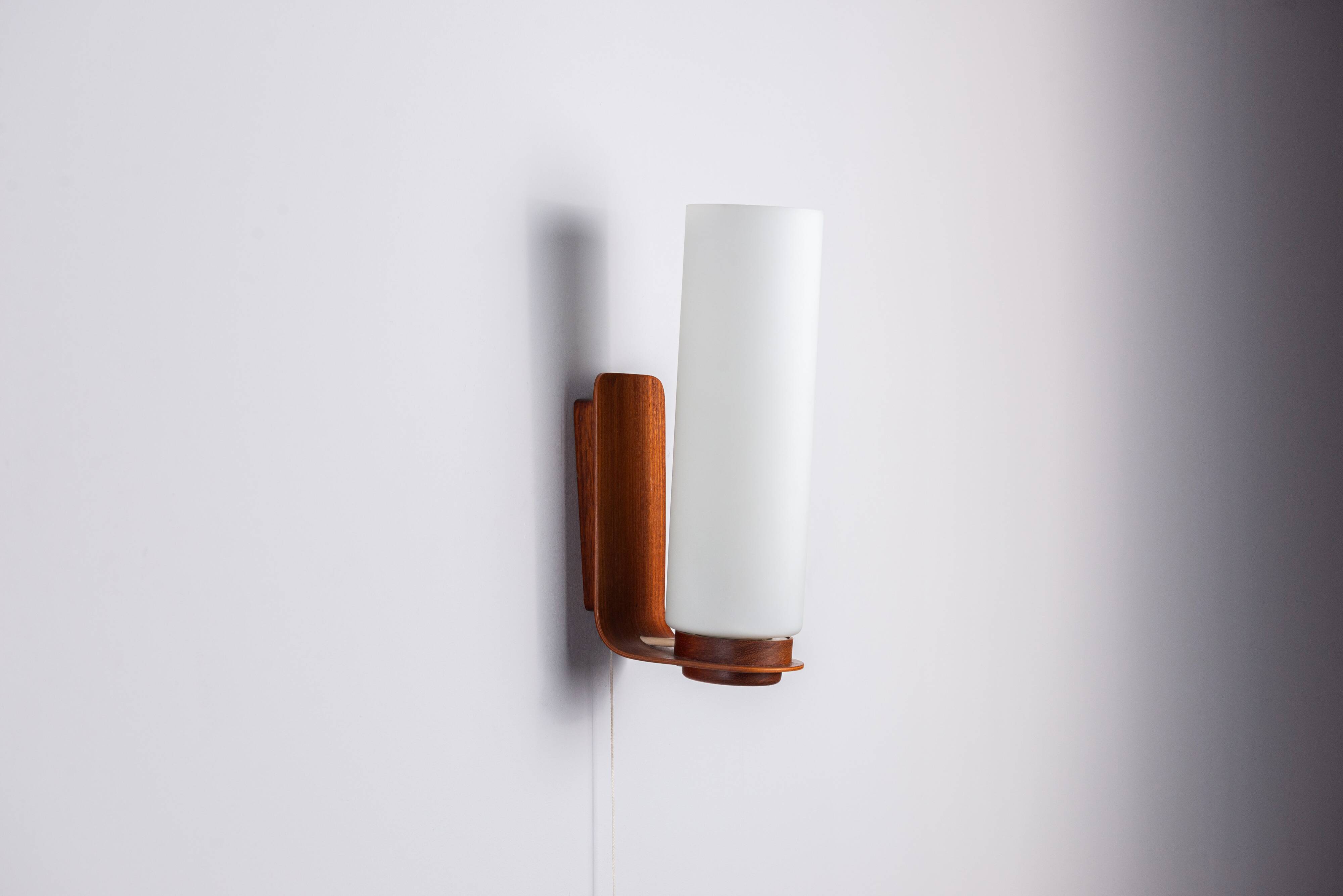 Cilindrical opal glass and bent wood wall lamp
