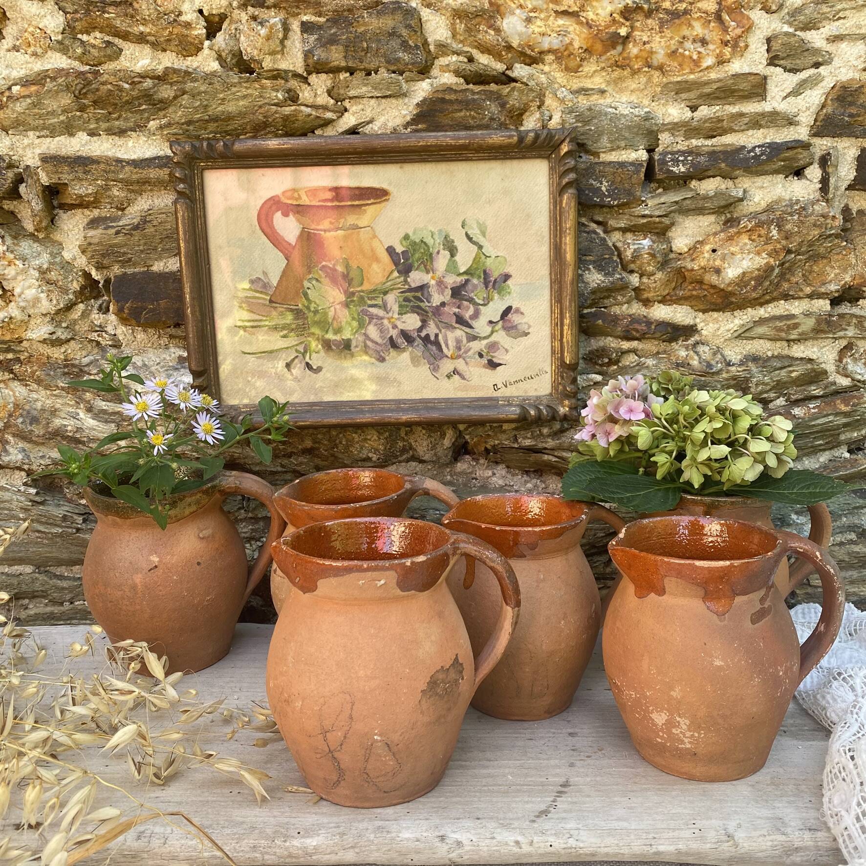 set of terracotta jugs country style