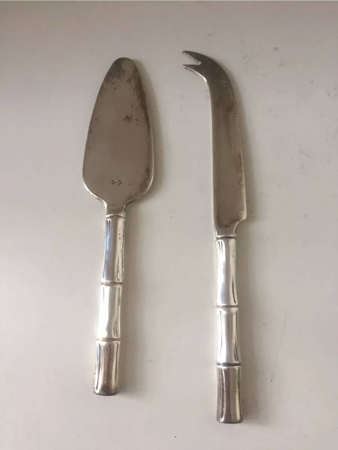 Silver-plated metal cheese serving cutlery and bamboo