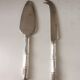 Silver-plated metal cheese serving cutlery and bamboo