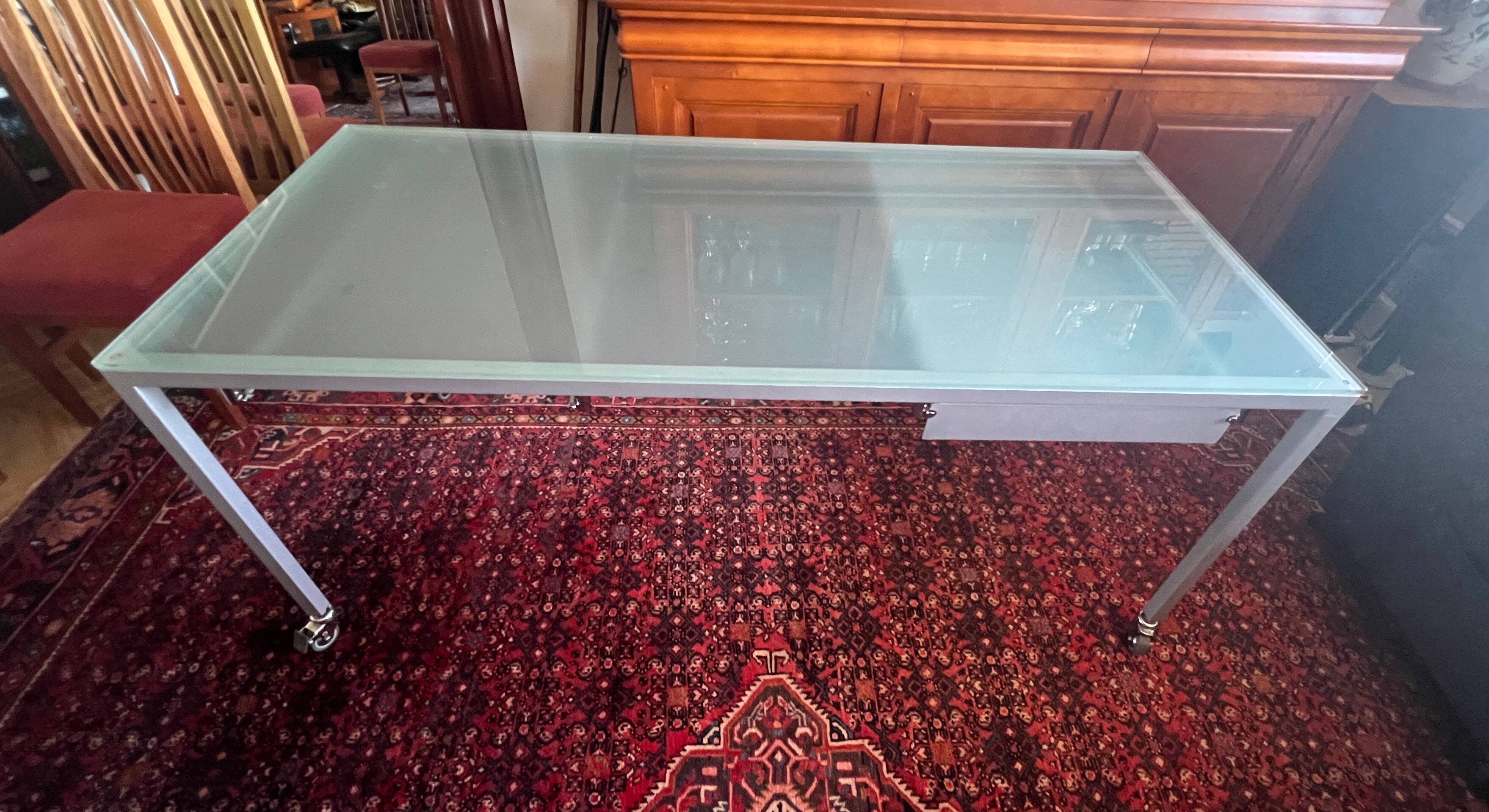 Glass and metal desk with wheels