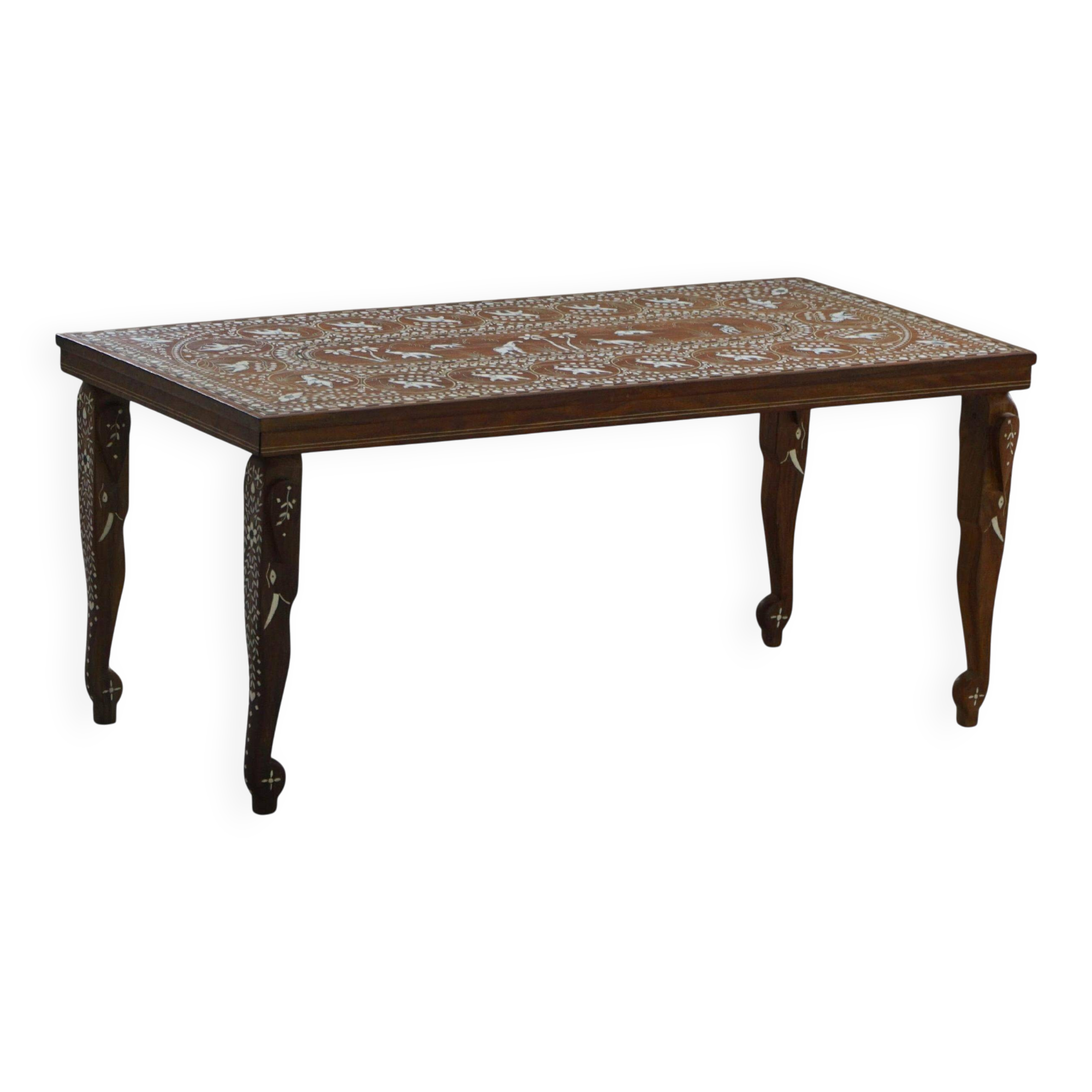 Vintage Indian teak coffee table inlaid with elephant motifs, mid-20th century.