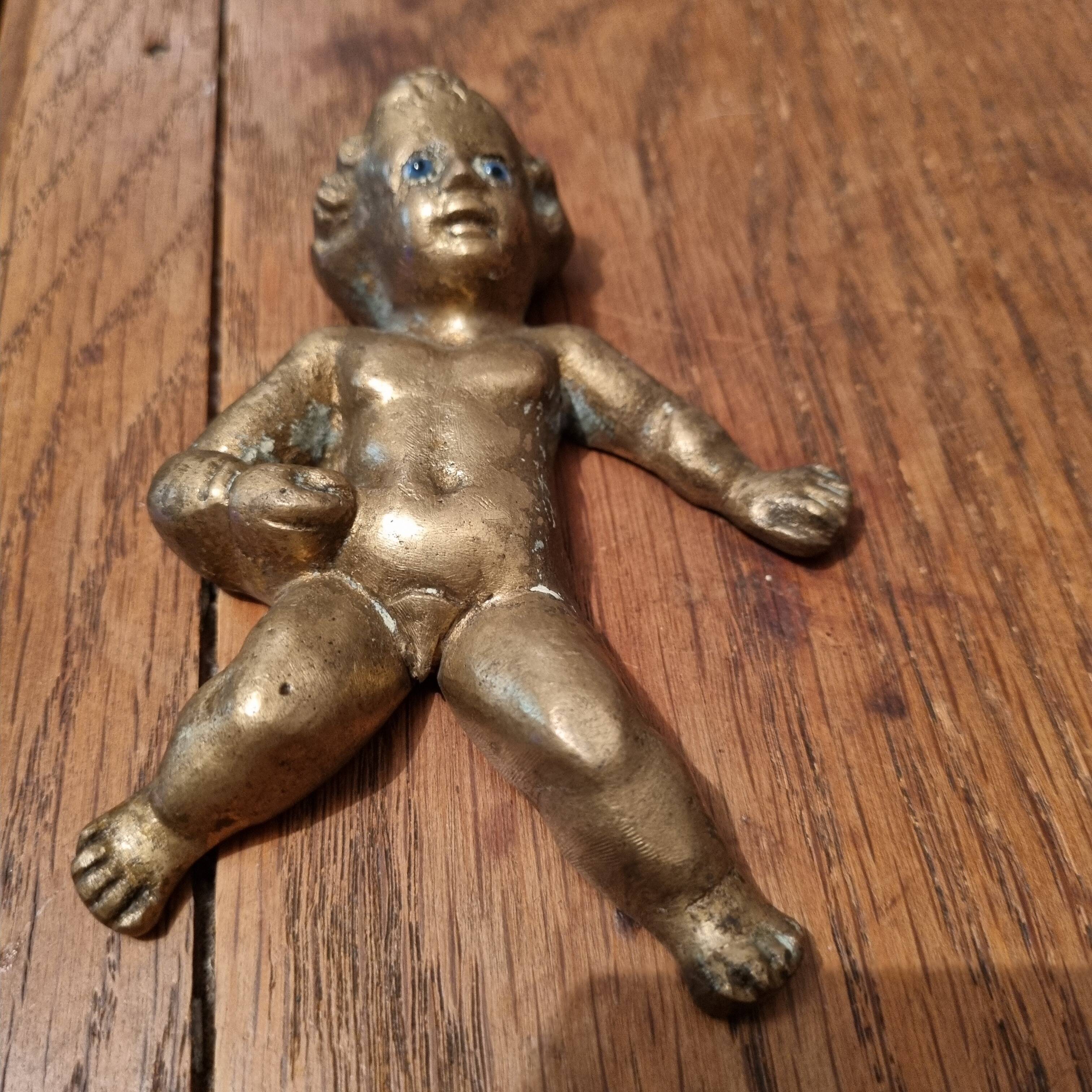 Rare bronze child statuette with blue eyes