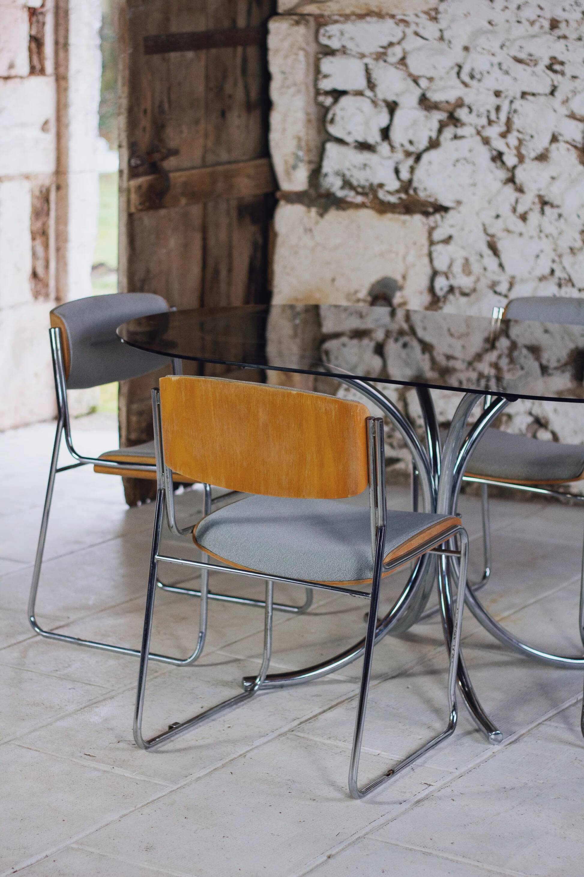 Oval dining table in chrome and smoked glass, 1970.