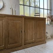 Large row of solid oak loom sliding doors