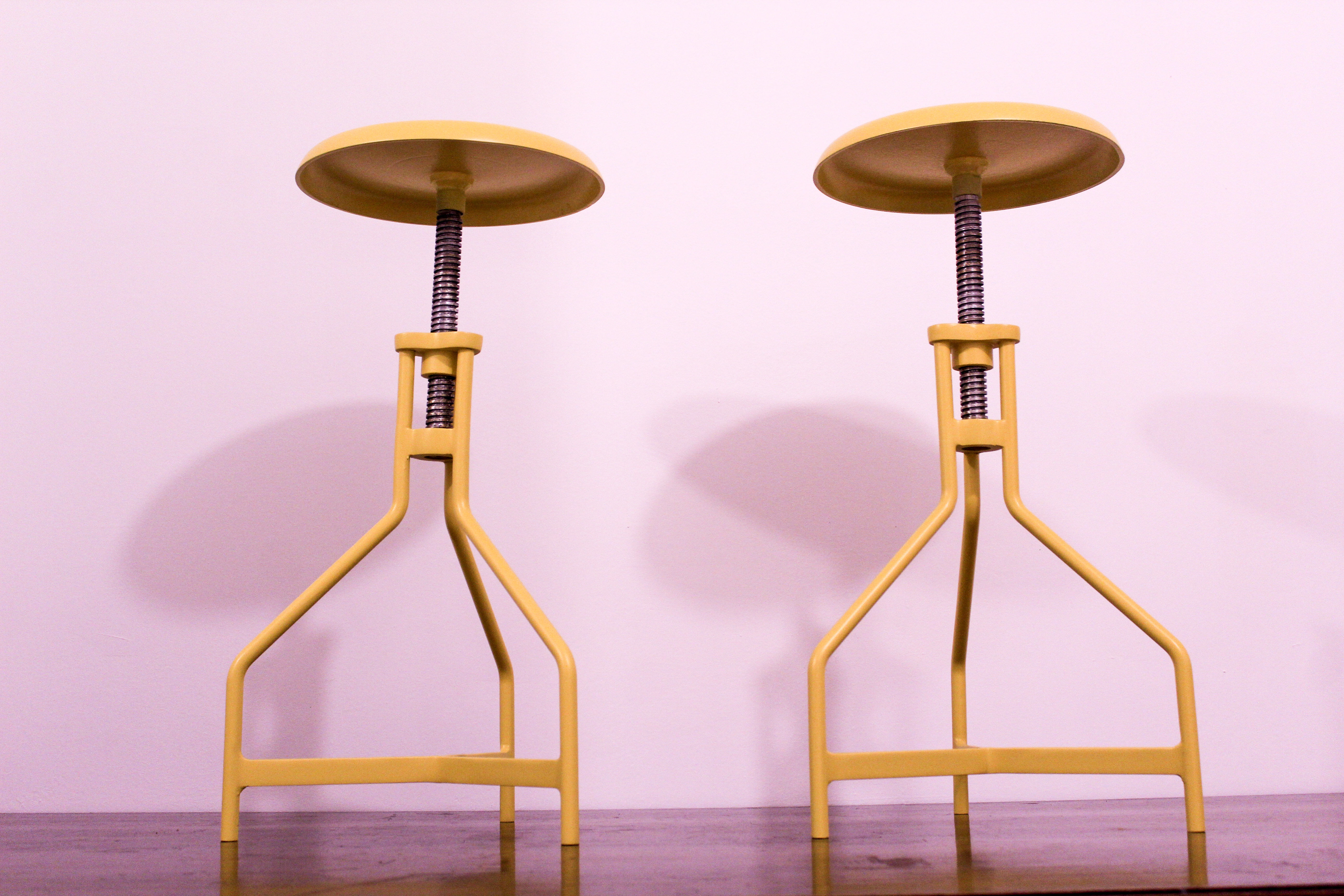 Pair of yellow lacquered metal stools, Restaurati, Italy 70's