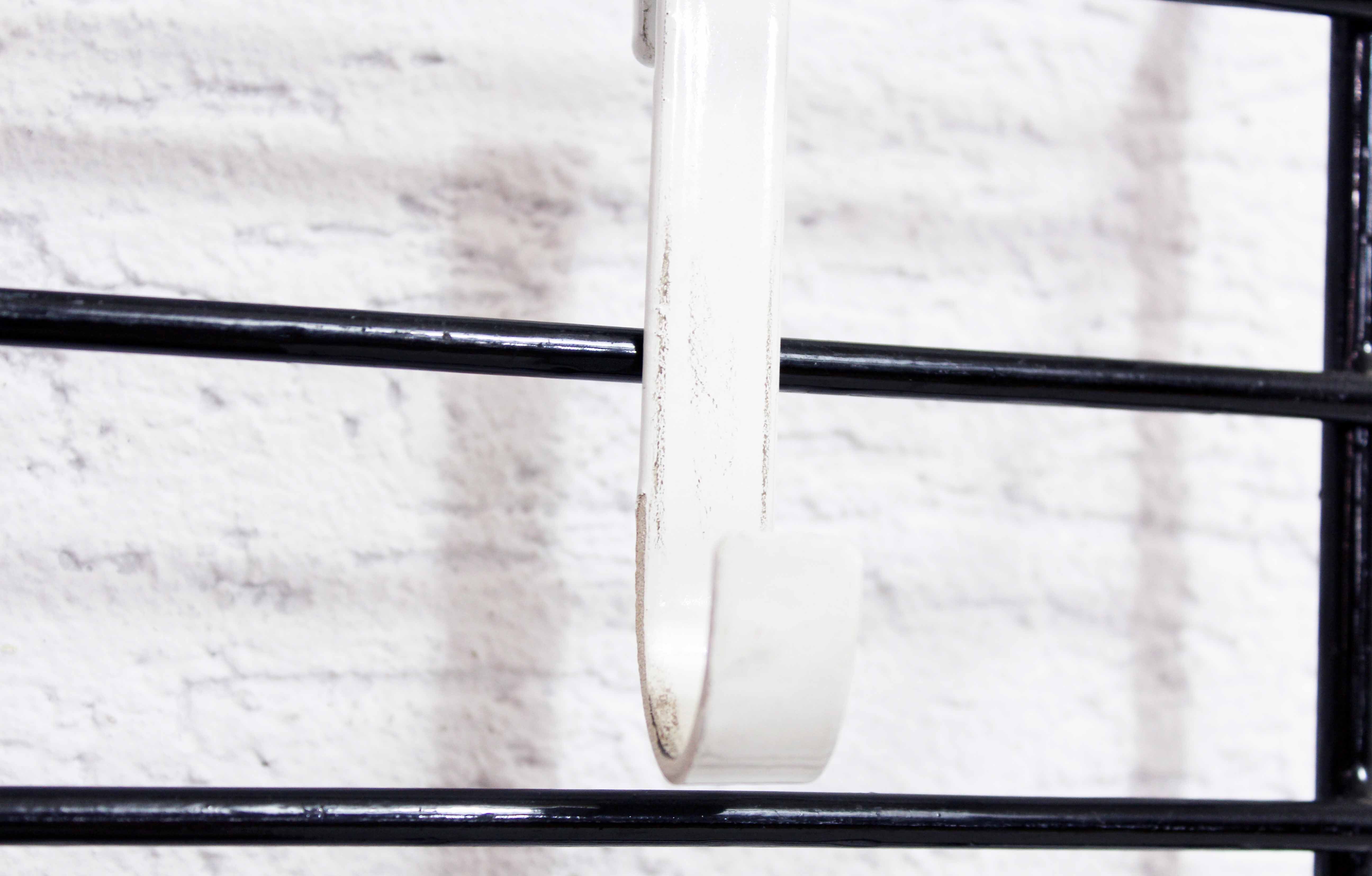 Wall coat rack with removable hooks