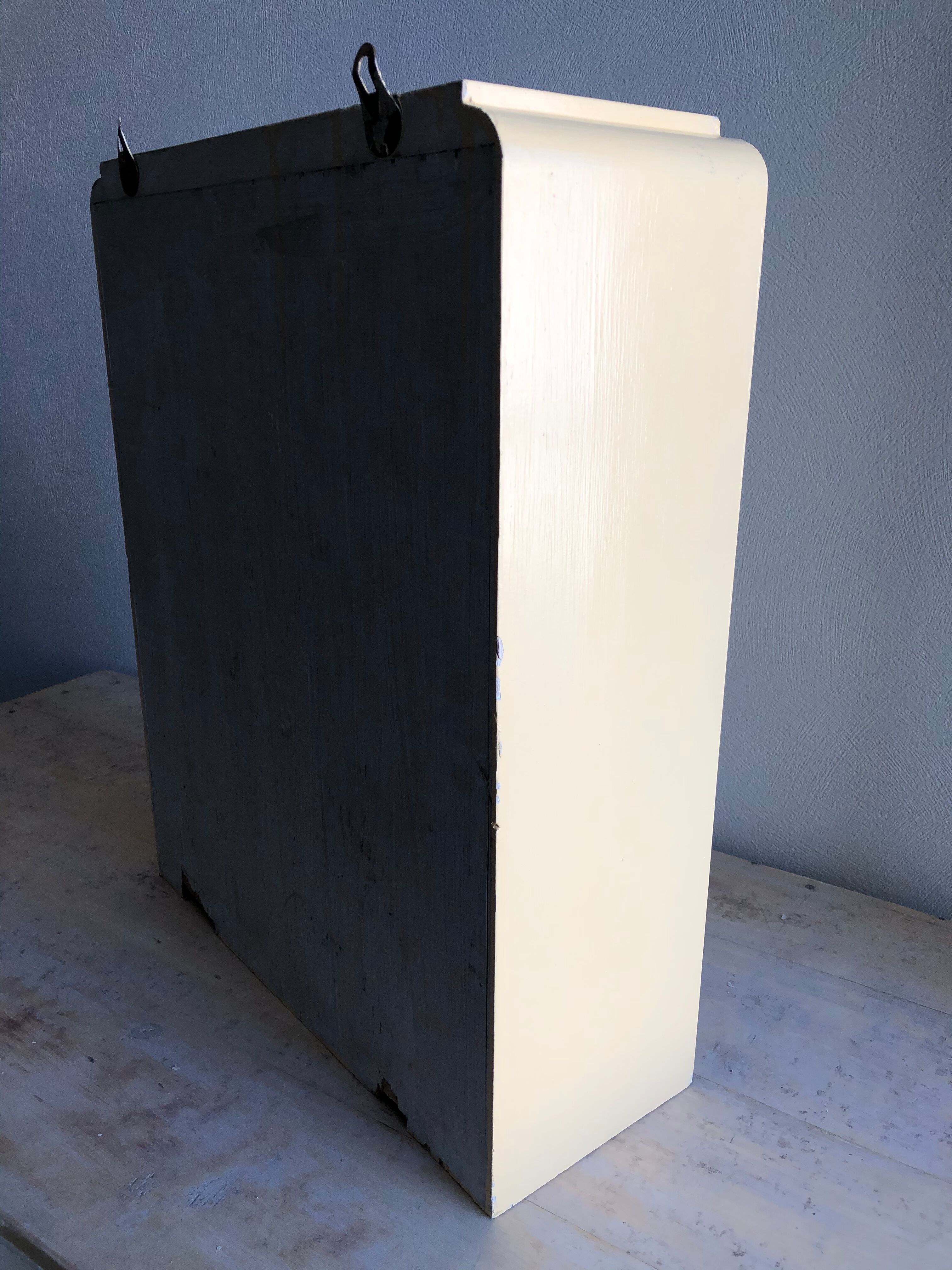 Weathered toilet cabinet