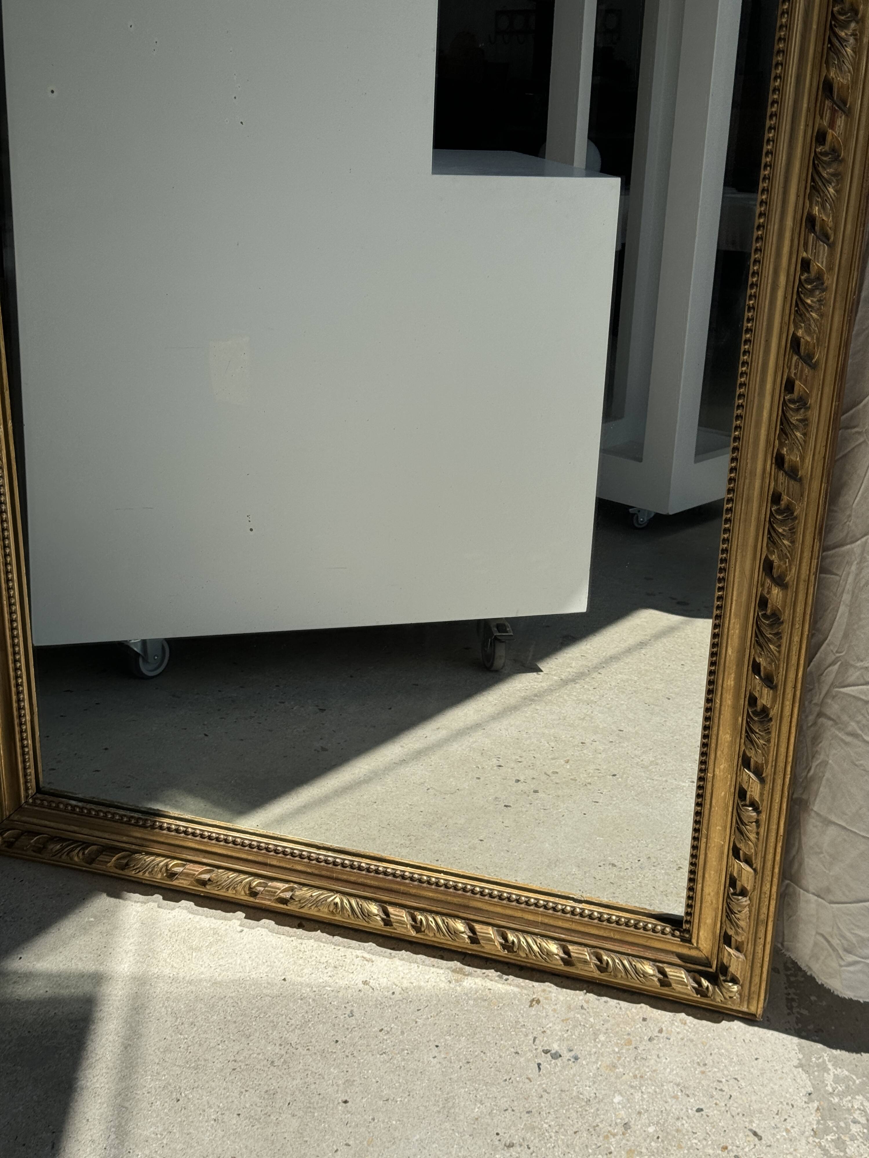 Large gilded mirror with acanthus leaf pediment H150 L98