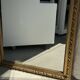 Large gilded mirror with acanthus leaf pediment H150 L98