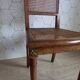 Art Deco caned chair with bronze ornaments.