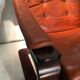 Duo of ochre leather and wood frame armchairs