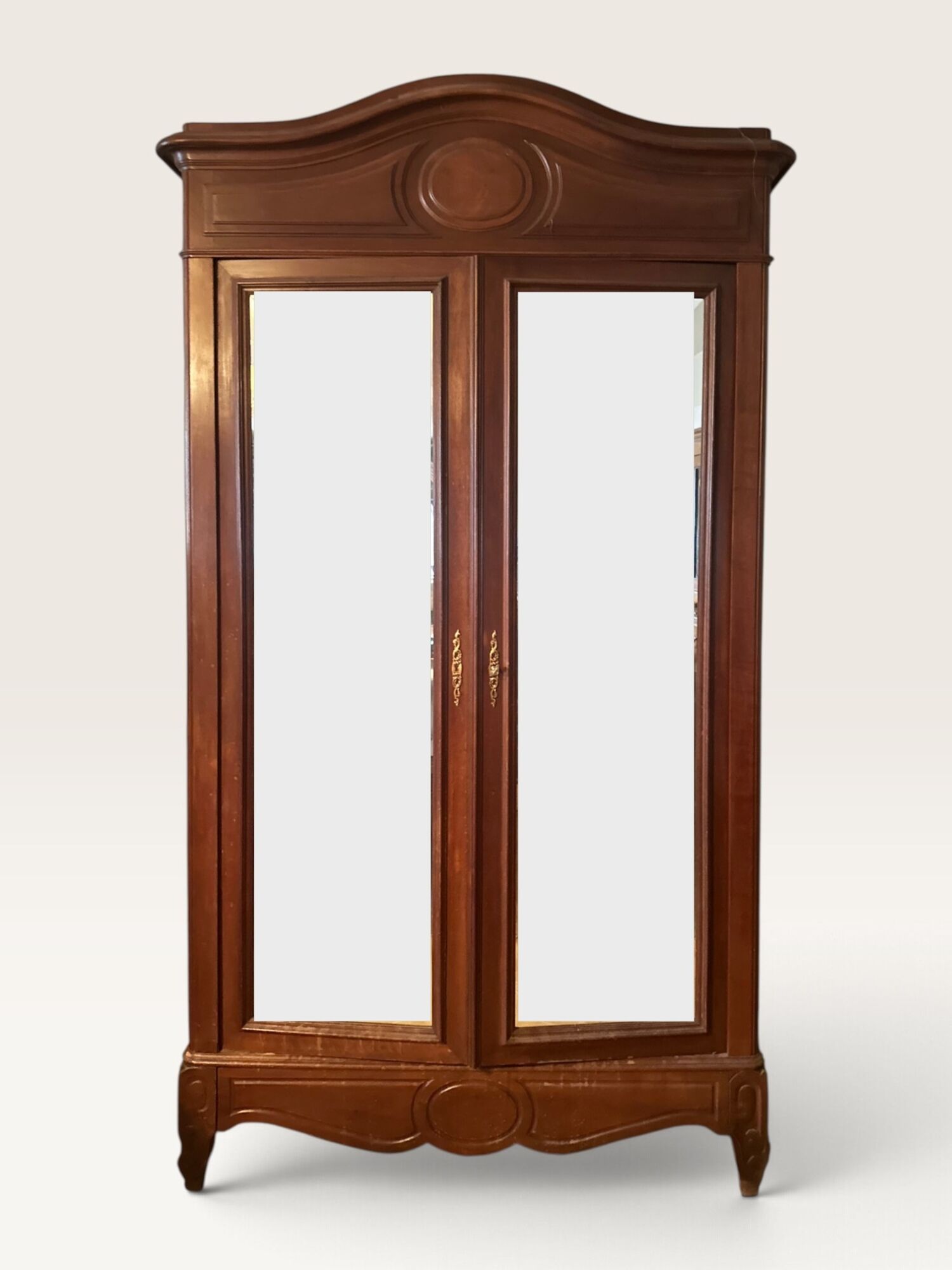 Louis XV style armoire with two bevelled mirror doors.