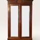 Louis XV style armoire with two bevelled mirror doors.