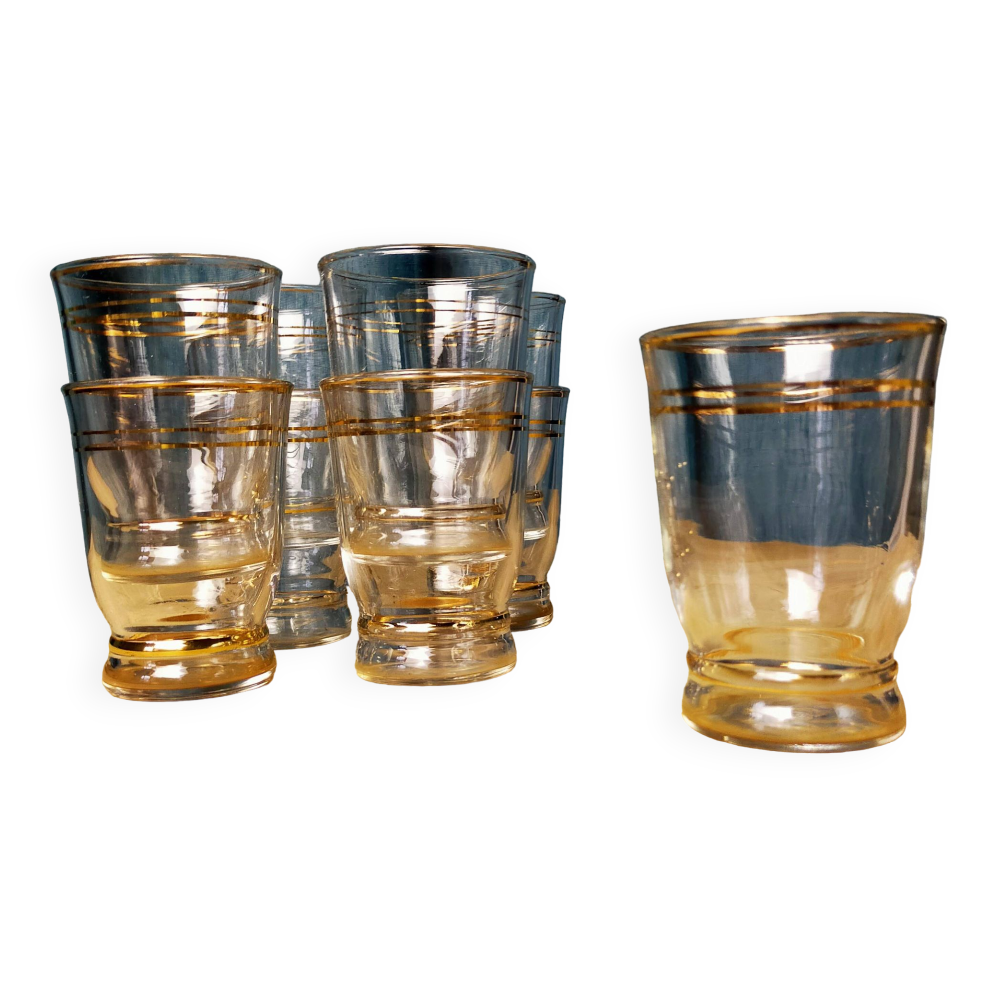 Set of 9 antique glasses with gold rim.