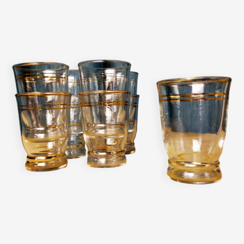 Set of 9 old glasses with golden net