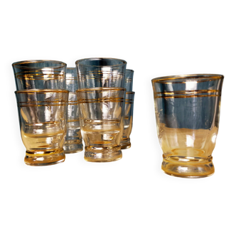 Set of 9 old glasses with golden net