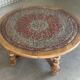 Vintage coffee table in turned wood and leather with astrological decoration.