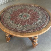 Vintage wooden turned coffee table with leather and astrological decoration.
