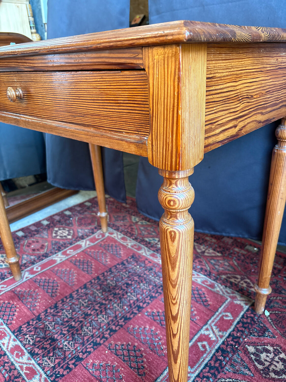 Small solid wood desk with a drawer.