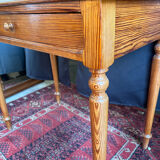 Small solid wood desk with a drawer.