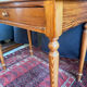 Small solid wood desk with a drawer.