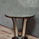 Art Deco guéridon resting on a central base made of stained wood.