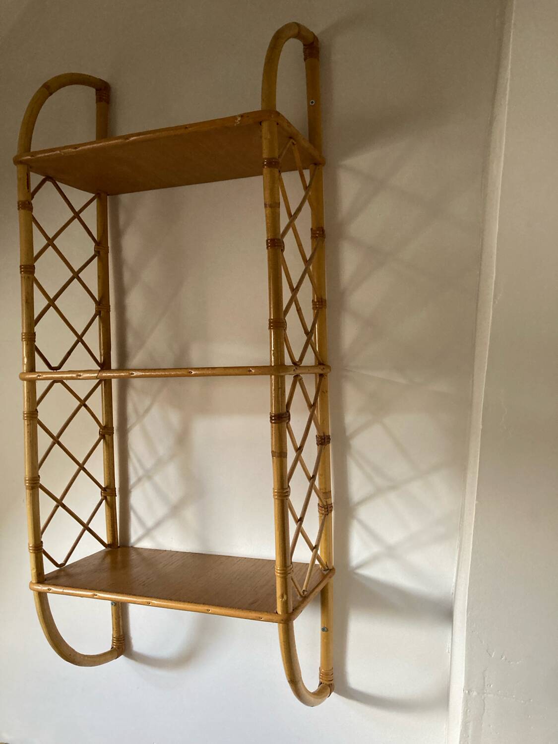 Vintage vertical wall mounted rattan shelf