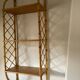 Vintage vertical wall mounted rattan shelf