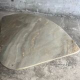 Light gray solid granite coffee table with organic triangular shape and conical base, 1980s