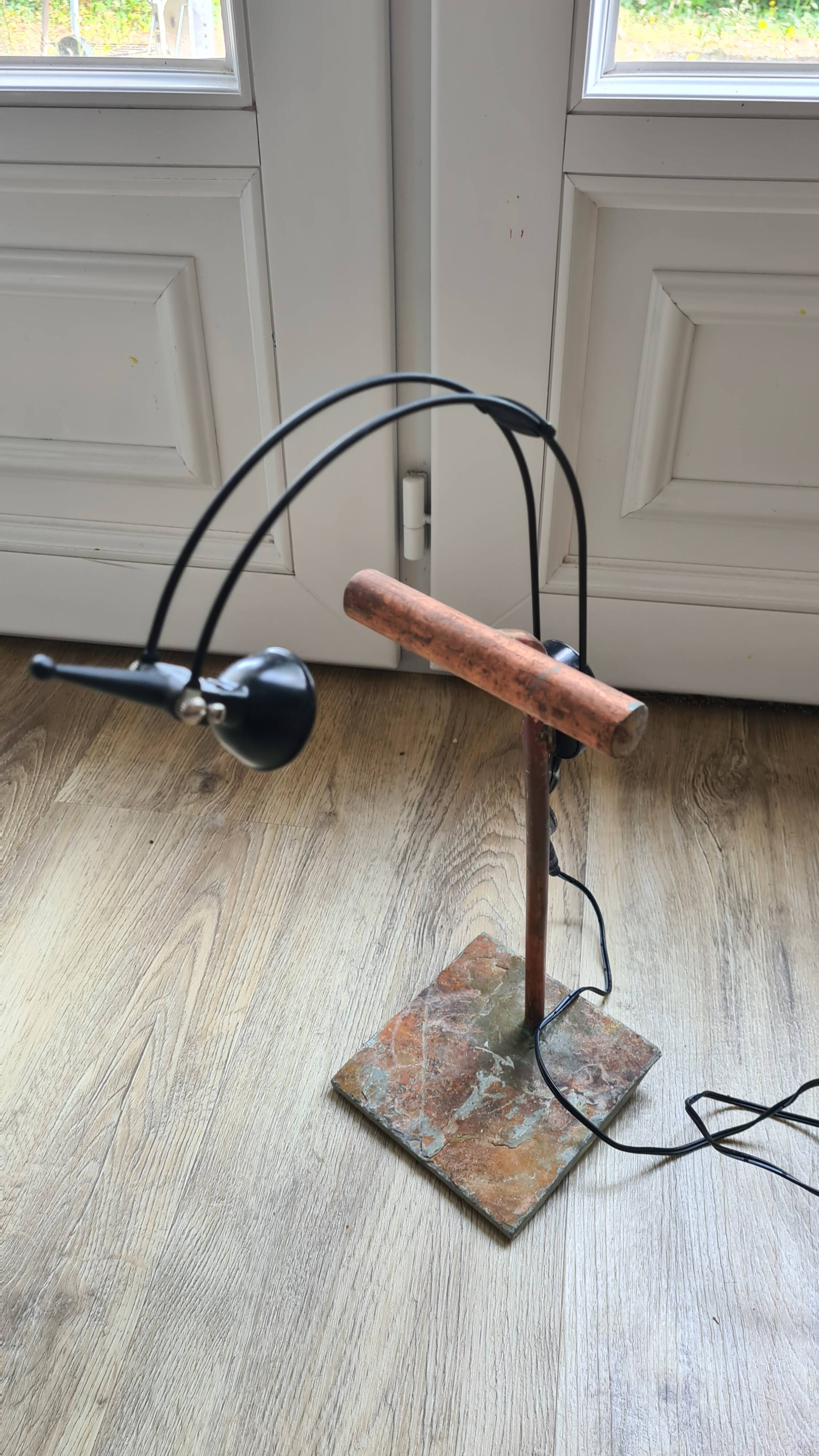 old lamp with stone base and copper arm