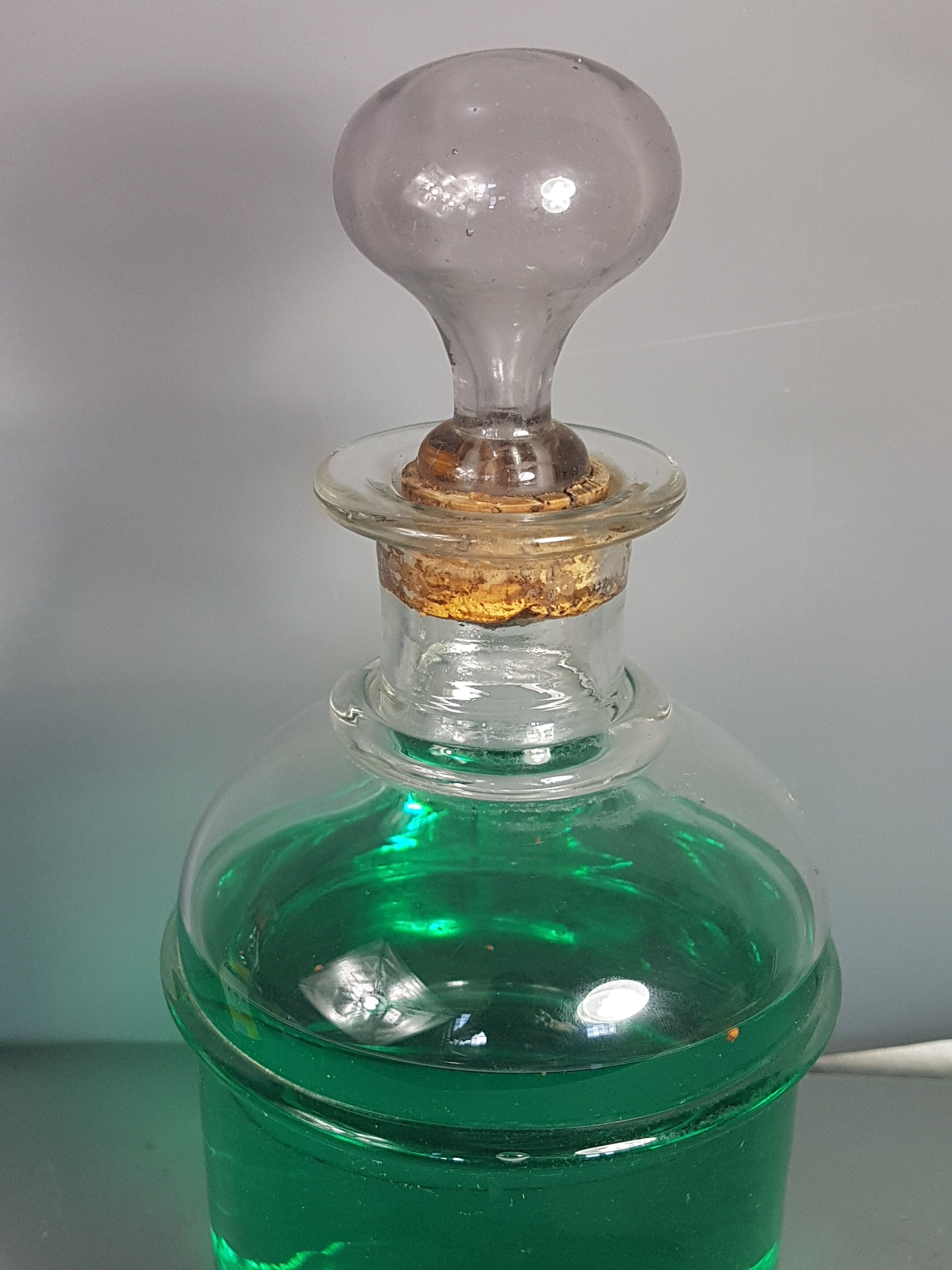 Old bottle of 19th century blown glass